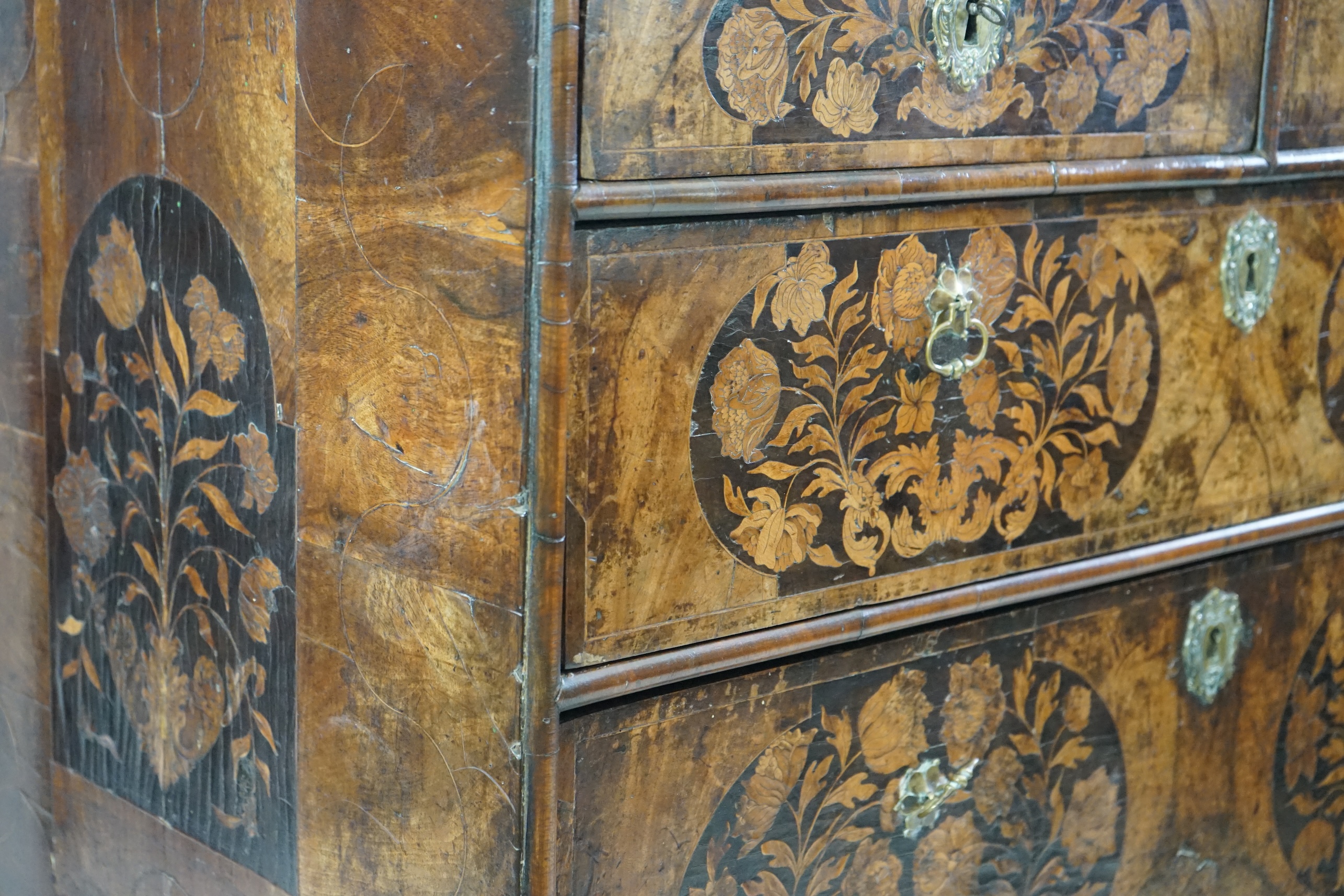 A William and Mary walnut and marquetry chest on stand